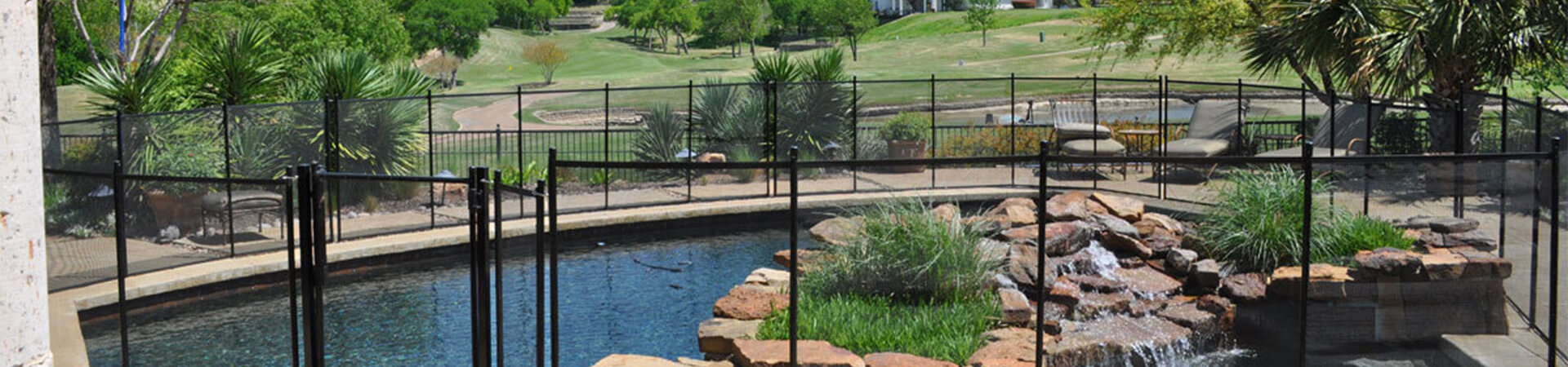 swimming pool gate with a waterfall inside the pool